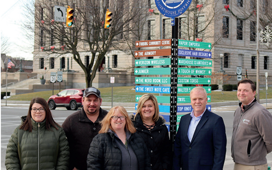 Signage directs individuals to Kenton businesses